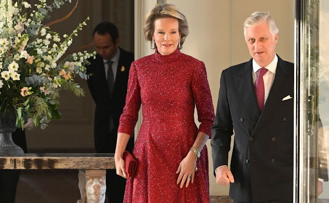 Queen Mathilde wore a claret red Luigi sequin high neck midi dress by Natan. Natan Couture Autumn Winter 2023 collection