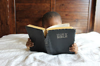 Boy Reading Bible - Photo by Samantha Sophia on Unsplash