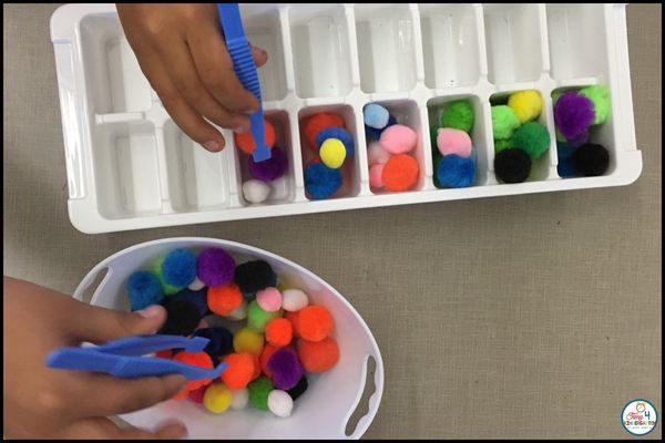 using tweezers for fine motor development