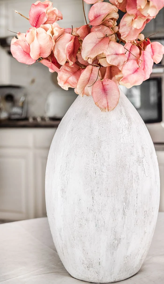 earthenware vase with pink flowers