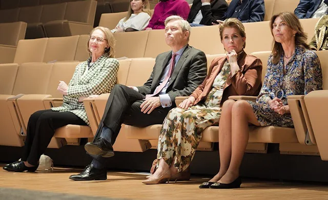 Grand Duchess Maria Teresa wore Contisy floral print silk turtleneck top and trousers by Dries van Noten. Joseph silk blazer Mahogany