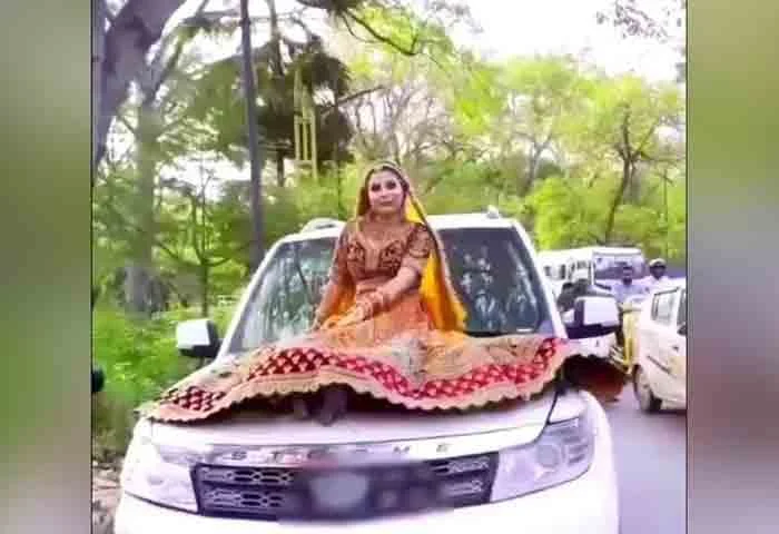 bride-rides-on-car-bonnet-gets-fined-rs