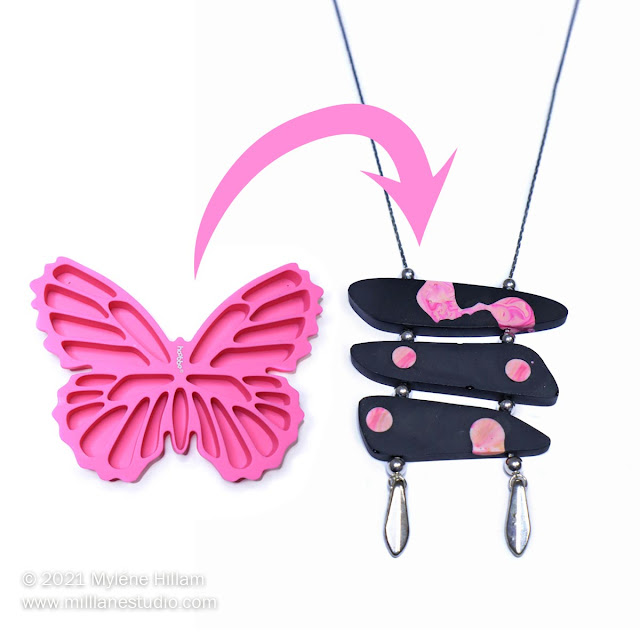 pink silicone butterfly ice cube tray alongside a black resin ladder necklace dotted with pink and apricot resin swirls