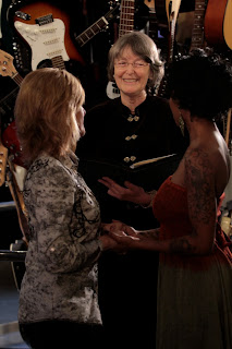 Lisa and Noelle wed at the EMP under the Guitar Tower.  Patricia Stimac, Seattle Wedding Officiant