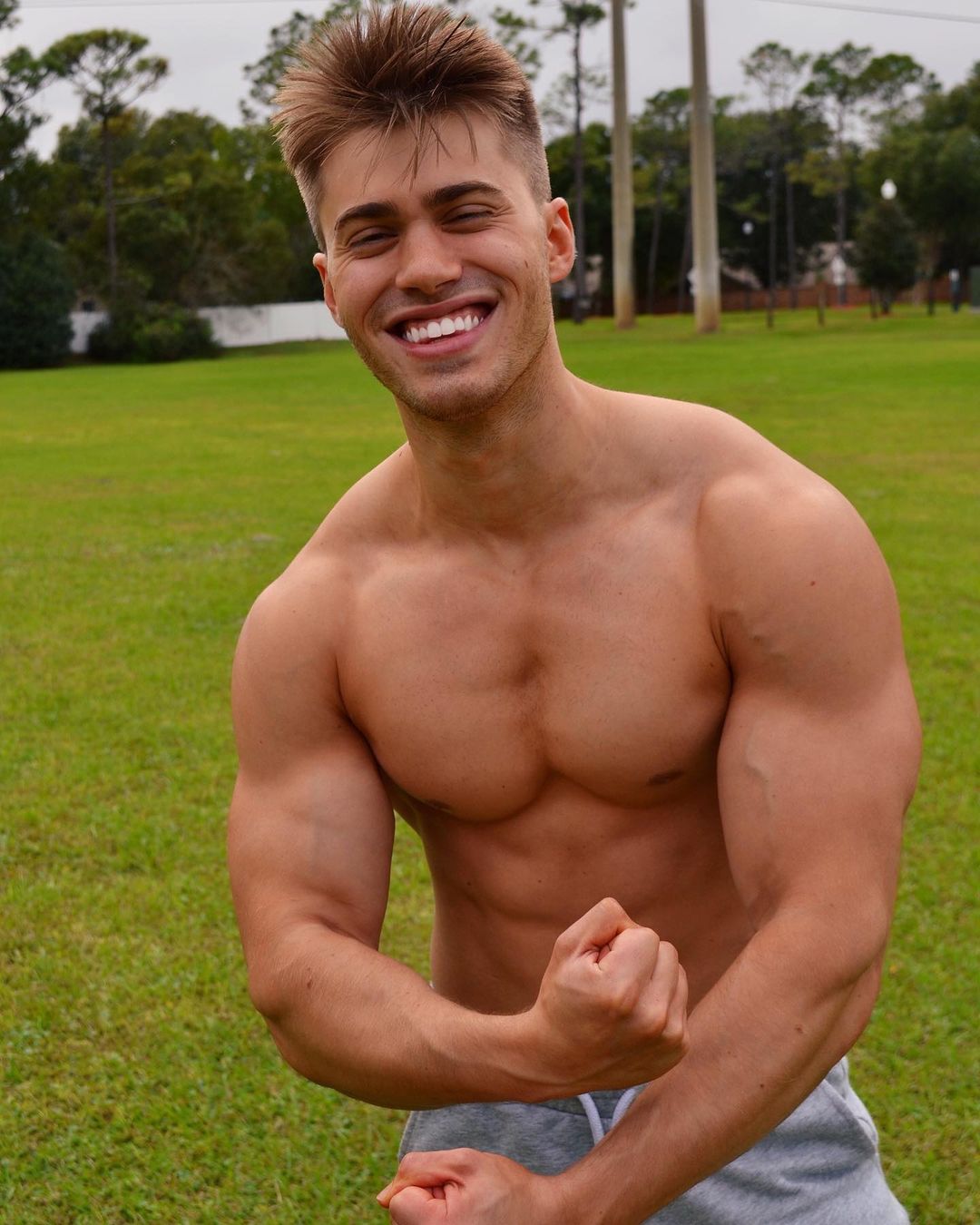 young-fit-hot-shirtless-guy-aaron-miller-muscle-biceps-flex-smile