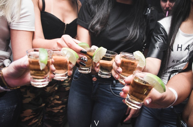 https://www.pexels.com/photo/women-holding-shot-glasses-1304473/