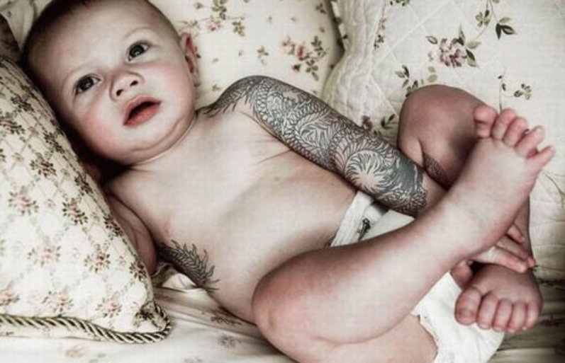 angel holding baby tattoo. images angel holding aby