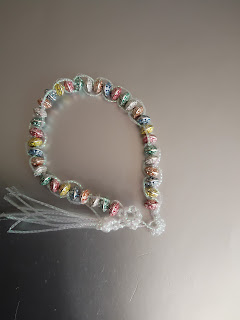 Bracelet made with metal beads & tatted iridescent braiding cord