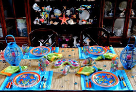Tropical fish tablescape, Department 56 Mirage plates, tropical fish glasware.