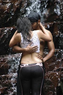 Indian actress Sneha Ullals wet pants get sticked to her body and expose hot thighs and sexy back