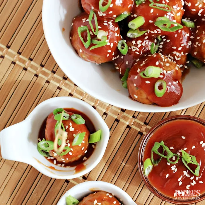 Asian Pork Meatballs in a sweet and tangy Asian style bbq sauce ready to serve as an appetizer