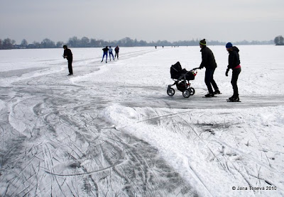 Skating frozen lake Reeuwijk Holland