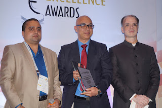 Mr. Chetan Verma, Vice President - Strategy, NBHC receiving the award