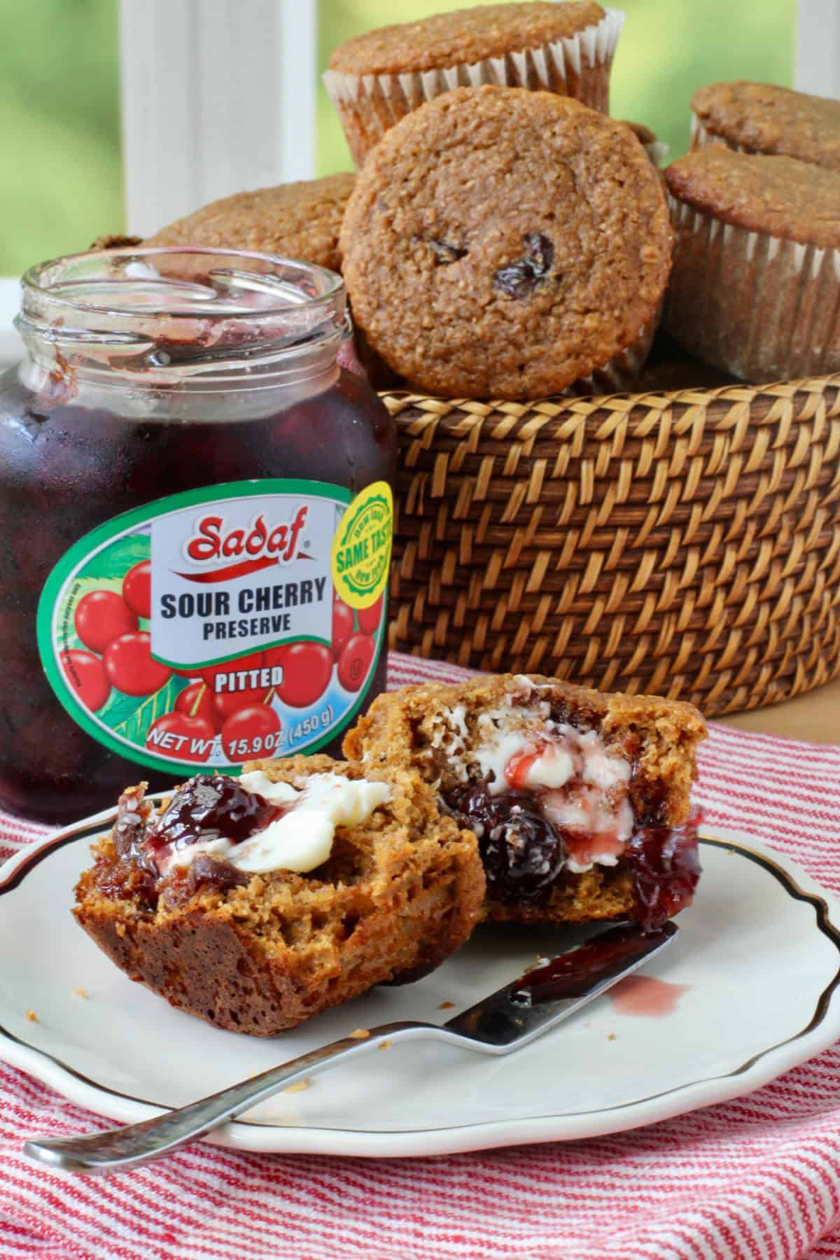 Molasses Bran Muffins with Cherries cut in half and spread with butter and jam.