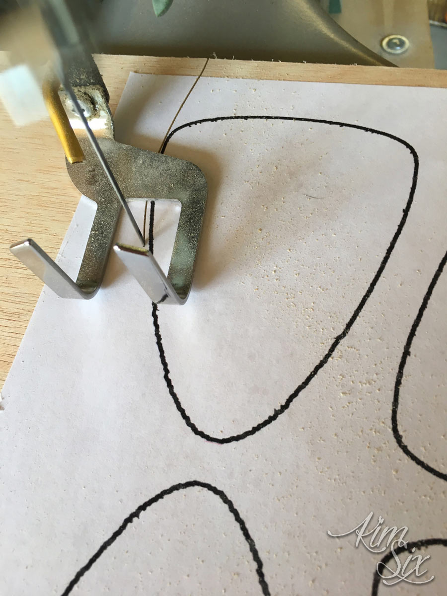 Cutting out candy corn with scroll saw