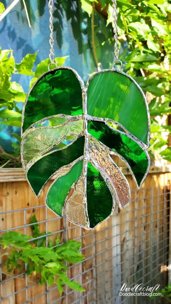 How to Make Monstera Leaf Stained Glass Sun Catcher!   Learn how to make a stained glass monstera leaf sun catcher from beginning to end.   Copper foil stained glass is a great way to make a little stained glass hanger for the window without having to commit to an entire window.    Stained Glass Tutorial for BEGINNERS!