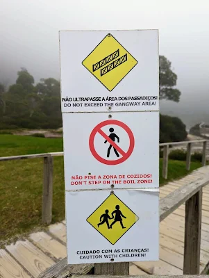 Signs warning "Don't Step on the Boil Zone" on São Miguel Island in the Azores