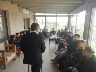 Secular high school students spending a day learning at the Bet El Yeshiva