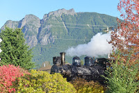 Steam locomotive 924 heads an excursion train departing west from North Bend.