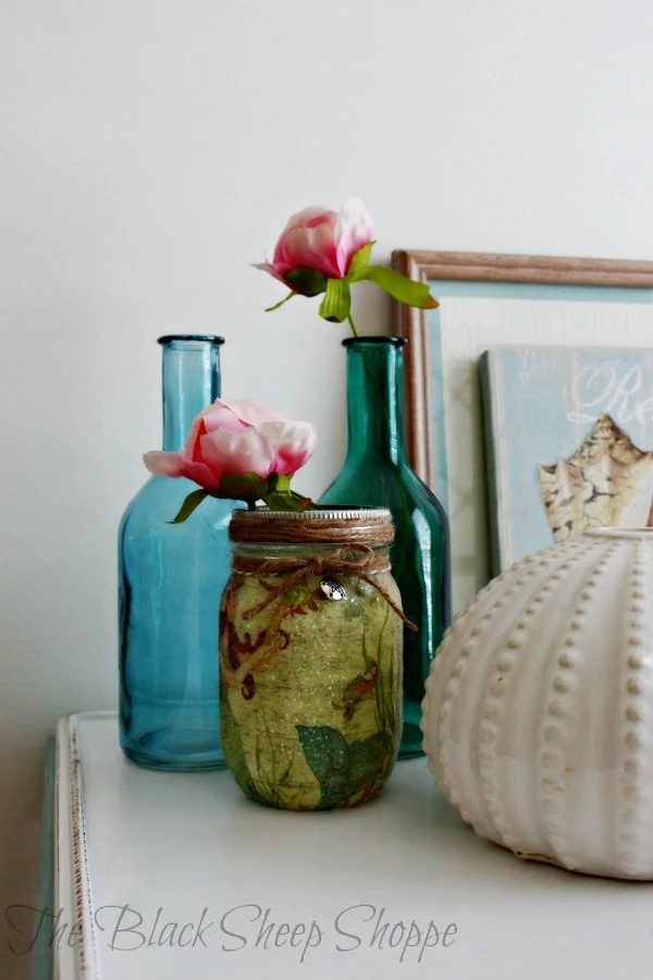 The mason jar has a coastal theme which works well with the other staging items.