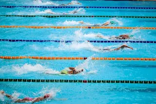 Swimmer in a pool doing a freestyle stroke