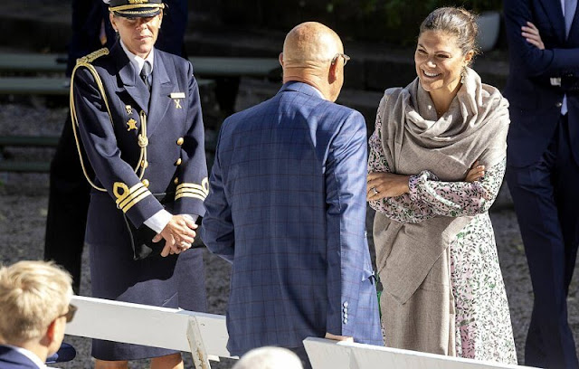 Crown Princess Victoria wore a floral print long-sleeve midi dress by Saloni. King Carl Gustaf and Queen Silvia