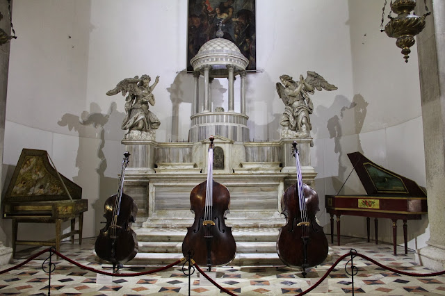 Museo della Musica display of historic instruments in a beautiful old church in Venice, Italy. 