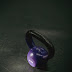 Violet metal kettlebell on black background