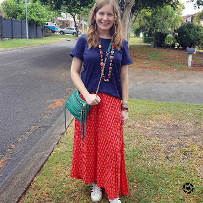 awayfromblue Instagram | red printed maxi skirt with green accessories for Christmas with navy frill sleeve tee