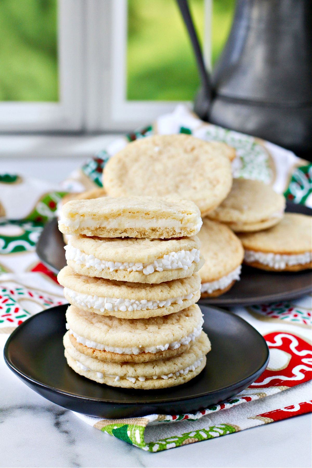 Peppermint Sandwich Cookies stacked on a plate.