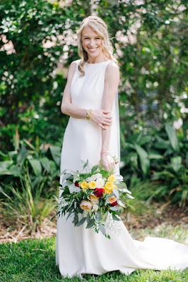 sweet bride with colorful wedding bouquet