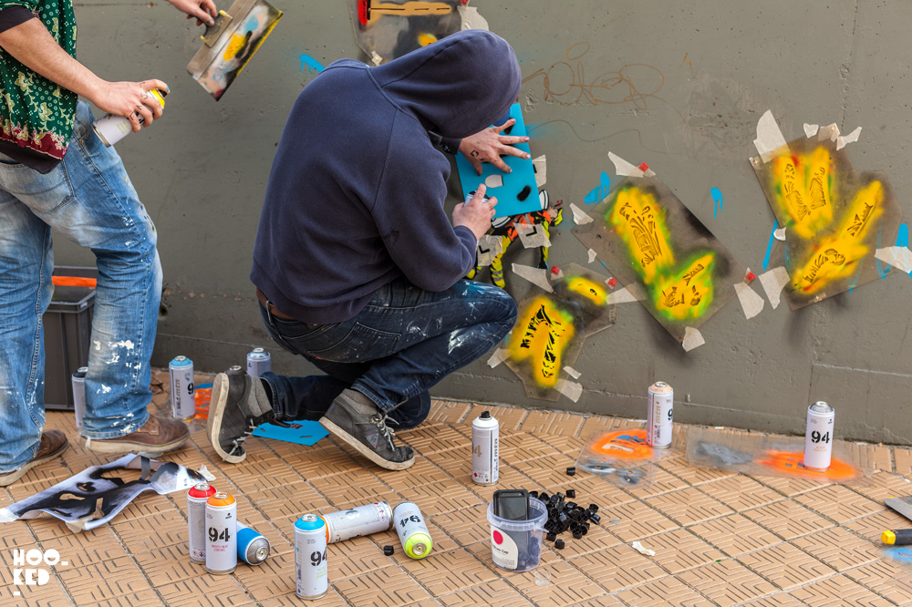 Street Artists OakOak and Jaune at work on a mural in Ostend, Belgium. Photo ©Hookedblog / Mark Rigney