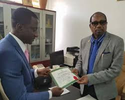 Giving certificate of return to Uche ogah