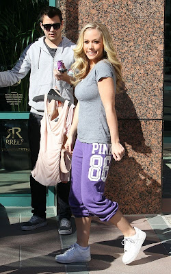 Kendra Wilkinson arriving at an office building with her assistant