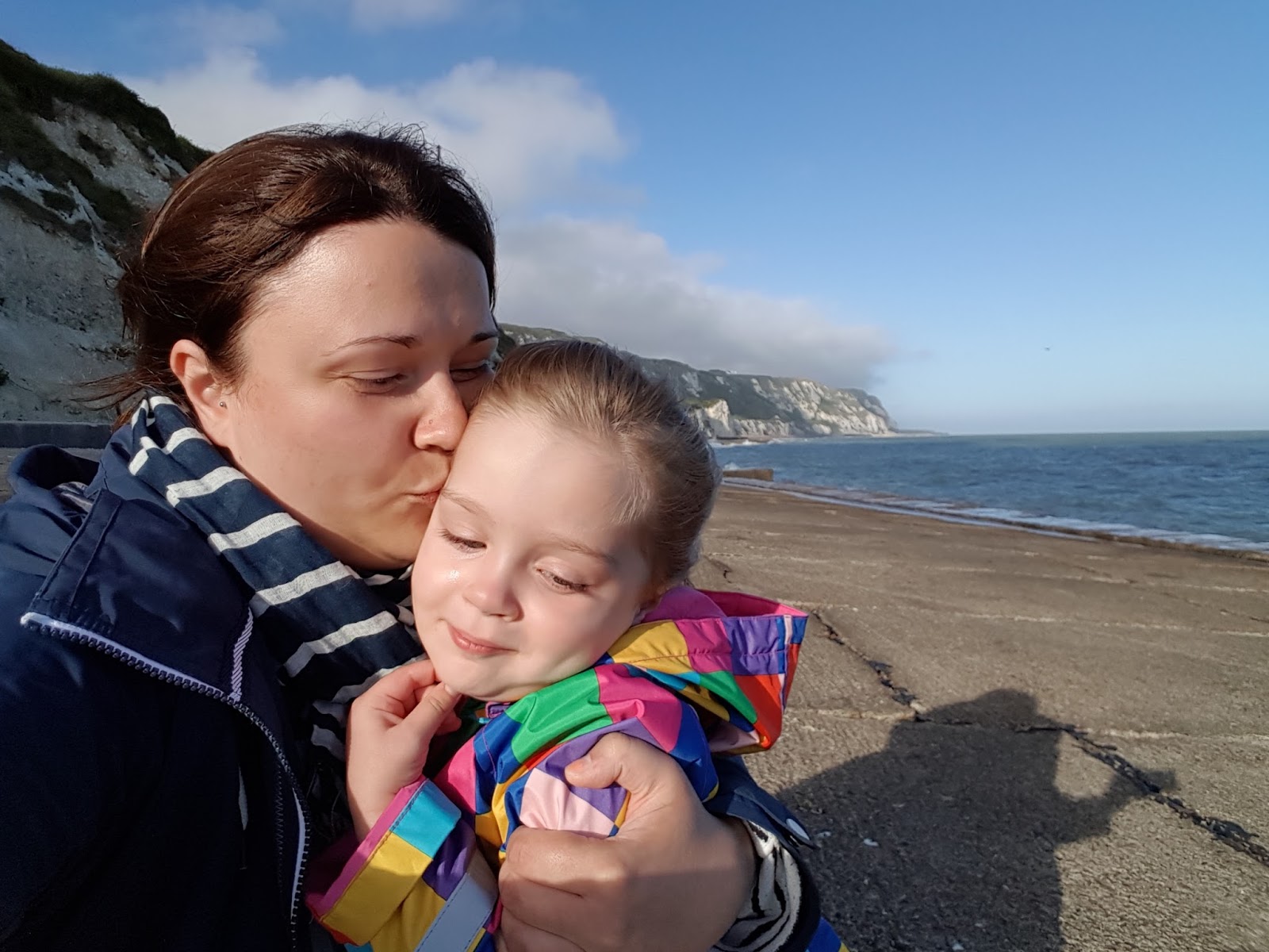 mummy kissing daughter at warren folkestone