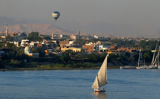 Sailboat and balloon; the Nile River at Luxor