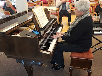 Claudette Wheeler playing the Schimmel grand piano