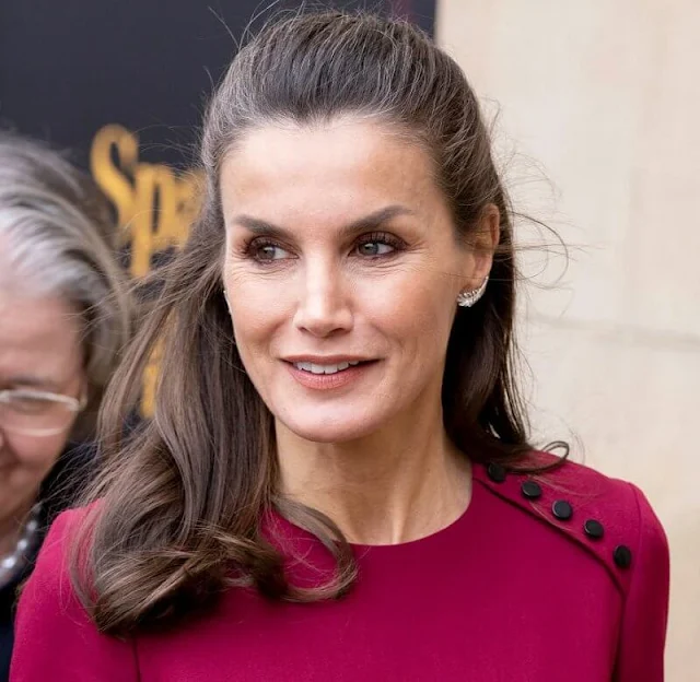 Queen Letizia wore a black wool and cashmere blend coat, and a new red midi dress by Carolina Herrera. The Prince of Wales