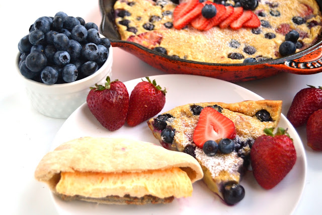 Strawberry Blueberry Dutch Baby makes the perfect breakfast or brunch dish! Made healthier with whole-wheat flour and loaded with fresh berries and ready in less than a half-hour. www.nutritionistreviews.com