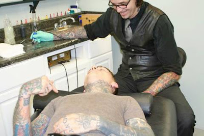 A Guy Gets His Face Tattoed