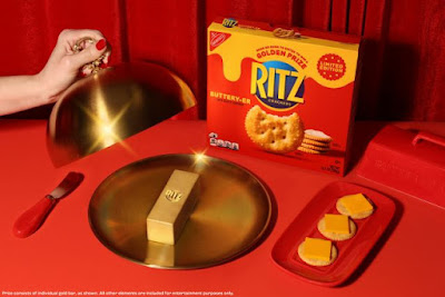 Ritz Buttery-er Crackers next to a butter-shaped 24-karat gold bar.
