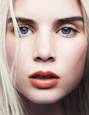 blonde hair pale skin blue eyes. Blue eyes, blond hair, dark, thick eyebrows, pale skin and red-orangy lips.