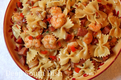 A quick and easy skillet pasta meal, made with medium shrimp, andouille sausage and a simple sauce. May also substitute chicken.