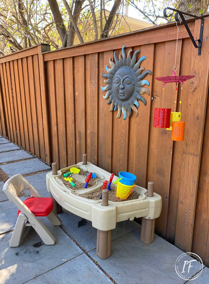 How to make bright and whimsical Upcycled Tin Can Wind Chimes with recycled food cans, a vintage strainer, and old necklace for unique garden decor.