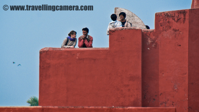 Jantar Mantar in Delhi - Another place to hang out with your Friends, Family and Special ones : Posted by VJ SHARMA on www.travellingcamera.com : There are lot many places in Delhi where families and couples like to spend some time with their loved ones. Jantar is another place where you can see the green lawns covered with families or some couples under the trees... Also college/school students prefer to have some masti around this place... n Thanks to the authority to offer the entry @ 5 Rs per person... Its located very near to CP in Delhi.. Here are few photographs of the place with some details...Jantar Mantar comparatively cleaner place in Delhi... I was very disappointed when I visited Red fort first time... It was in very bad shape and no one was worried about the cleanness of the place... The gentleman in this photograph was very much concerned about the cleanness of this place and he was also trying to educate people to help him in doing so... Sometimes folks come inside with eatables and don't think before spreading the waste around the green lawns of Jantar Mantar...Group of college students having some chit-chat on the roof of a structure on the right side of Jantar Mantar...There were lot of children there when we visited Jantar Mantar on a Saturday... Here is  a photograph of little baby running to win the race from his father can't catch him even after lot of efforts ... He used to stop and see how far his dad was... m starts running by giving him a smile :)Here is another little girl who was playing hide n seek with her elder sister... She was very naughty and her sister was not able to locate her unless she make some sound to tease her... They were here at Jantar Mantar with their parents and brother.. n it looked like a full day outing in Jantar Manatar only.. Whole family was here with all the stuff like carpet to sit, Badminton to play and lot of stuff to eat...Finally her sister caught her inside the yantra in the background of this photograph... But the littel girl is still not satisfied with the time her sister took to locate her... and she is asking the sis to close the eyes and search her again after 5 minutes...It seemed that Jantar is another popular place among couples in Delhi... but it was not like Lodhi Garden or Nehru Garden... It was more like spending time together and avoid the crowd areas of Delhi...Another romantic couple at Janatar Manatar, Delhi, INDIASome folks also come here to relax after some work or to avoid the business of delhi... The lawns inside Janatar Manatar are very clean and inviting... After spending some time in shooting these pictures, we also spent some time there to have some rest...Ankit got some clients to click photograph with colorful Janatar Manatar....