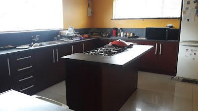 Large Kitchen with tiled floors and cupboards