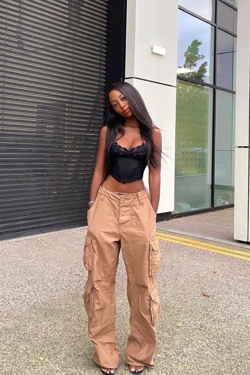 young woman in a stylish alternative fashion outfit wearing cargo pants