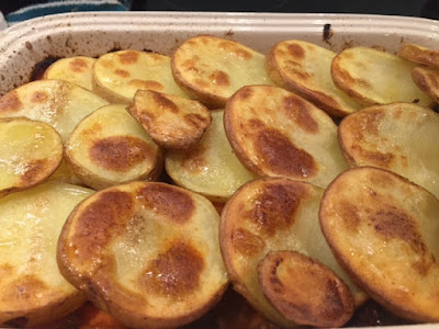 Cooked crispy potato slices on top of Beef Mince Hot Pot