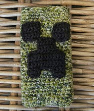 http://www.ravelry.com/patterns/library/minecraft-creeper-phone-cozy-cover