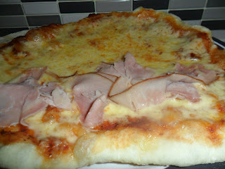 Homemade cheese and ham pizza